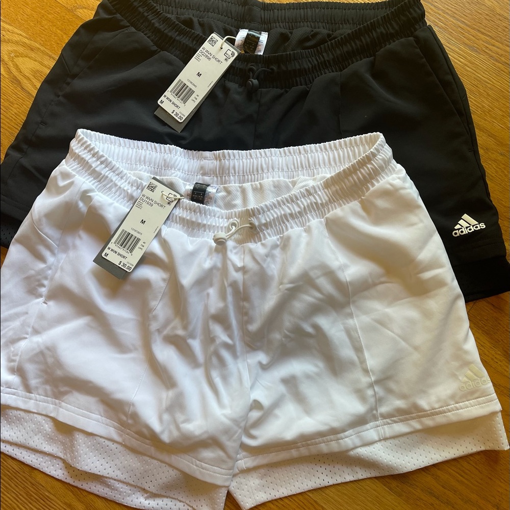 2 NWT pairs women’s Adidas running shorts. Lined, pull on.